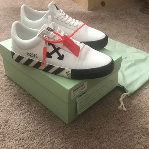 off white vulc low top on feet